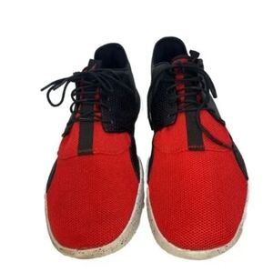 Red and black sports shoes